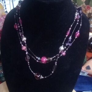 Signed "You si" glass and other beads on wire